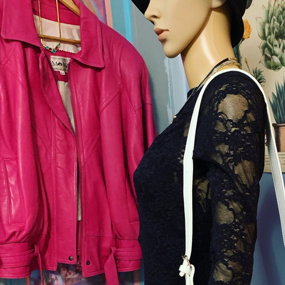 Barbie pink, batwing sleeve leather coat. Quintessential 80’s right here!! Mona